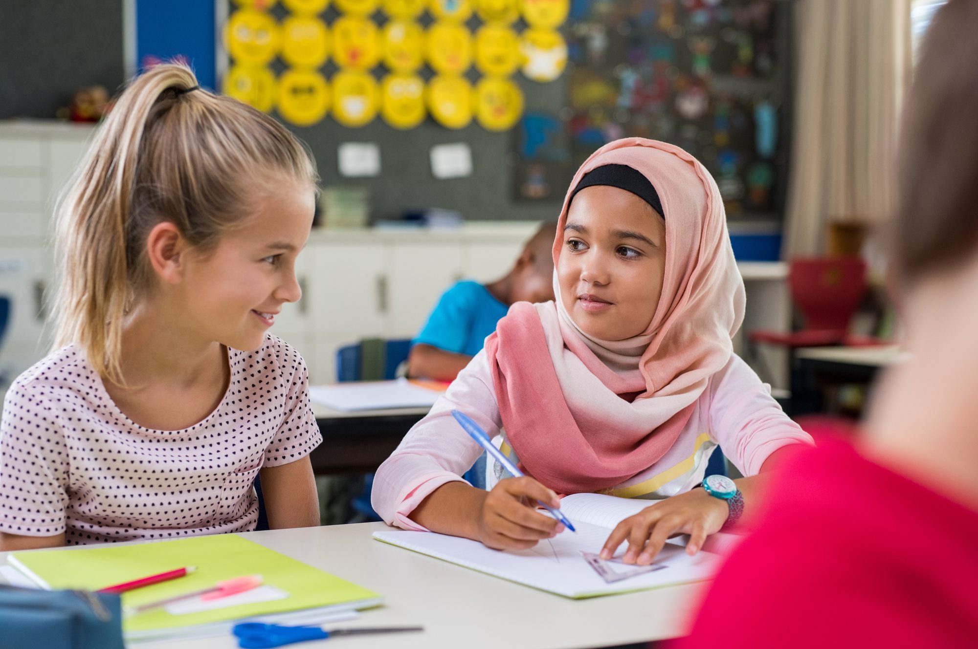 Young Arab Girl With Hijab Doing Exercise With Her Bestfriend at International School.