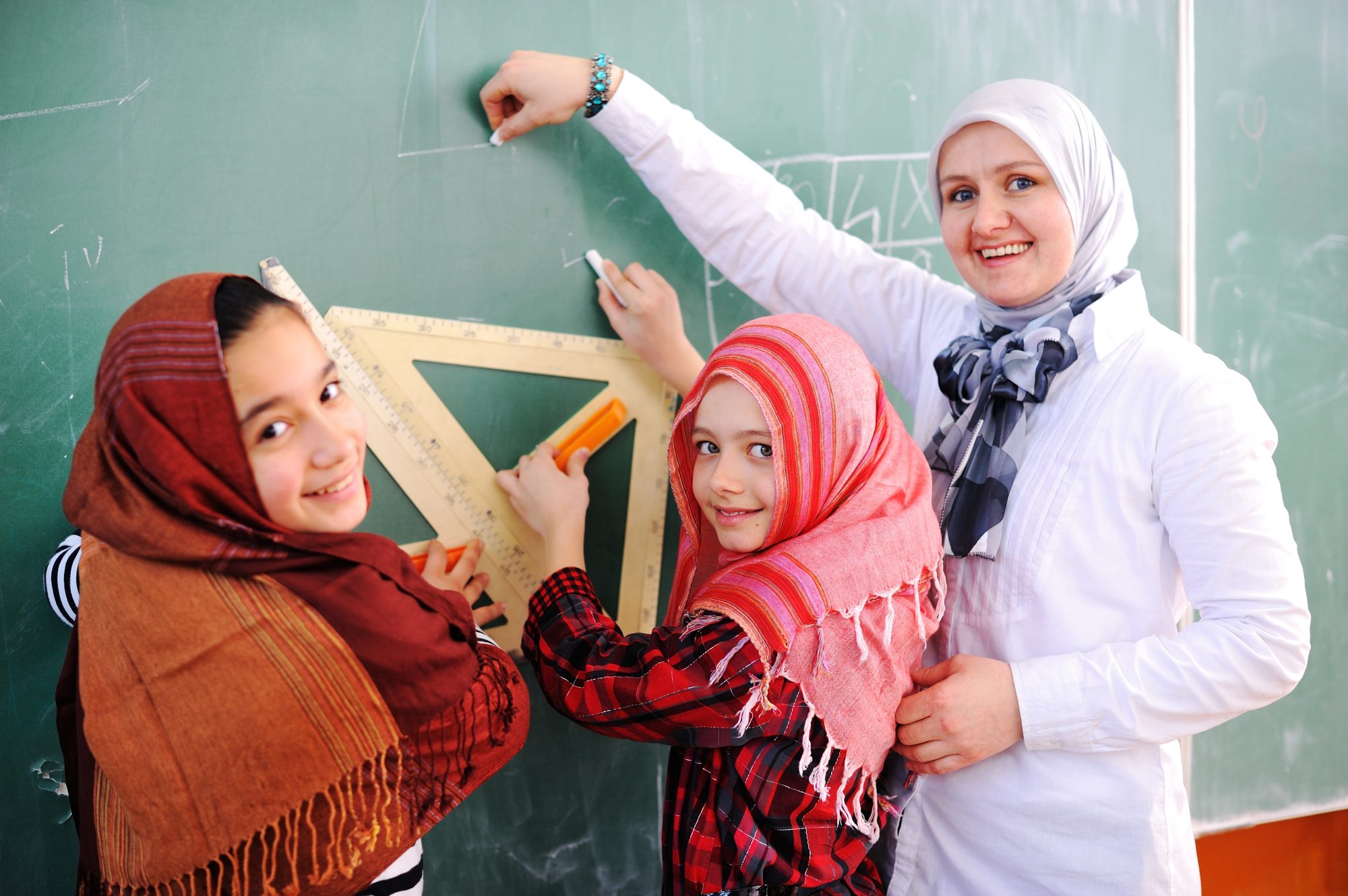 Cute Lovely Arabic School Children at Clasroom Having Education Activities.